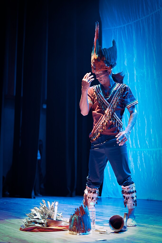 Shaman drinking ayahuasca during a ceremony